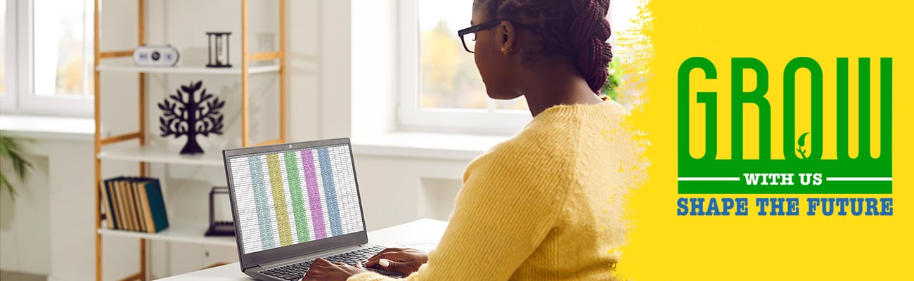 adult typing into a spreadsheet on a laptop computer - Grow with us, Shape the future