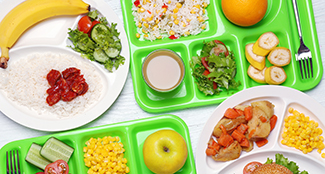 school lunch trays with food on them